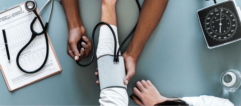 doctor checking blood pressure